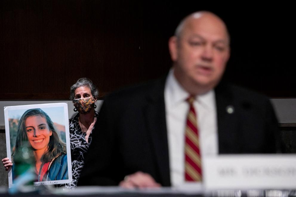 PHOTO: In this June 17, 2020, file photo, Nadia Milleron, mother of Samya Stumo holds a photo of her daughter as FAA Administrator Stephen Dickson waits to speak during a hearing on Capitol Hill, in Washington, D.C.