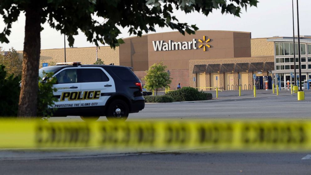 PHOTO: San Antonio police officers investigate the scene where eight people were found dead in a tractor-trailer outside of a Walmart store in stifling  heat in what police are calling a horrific human trafficking case, July 23, 2017, in San Antonio. 