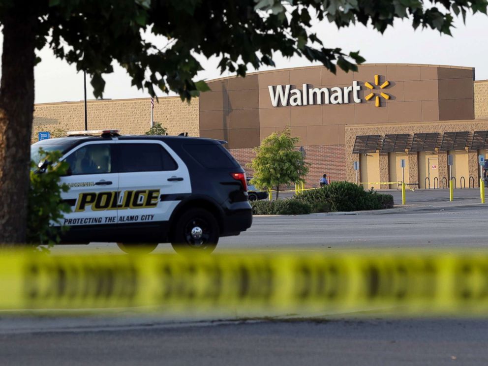 PHOTO: San Antonio police officers investigate the scene where eight people were found dead in a tractor-trailer outside of a Walmart store in stifling heat in what police are calling a horrific human trafficking case, July 23, 2017, in San Antonio.