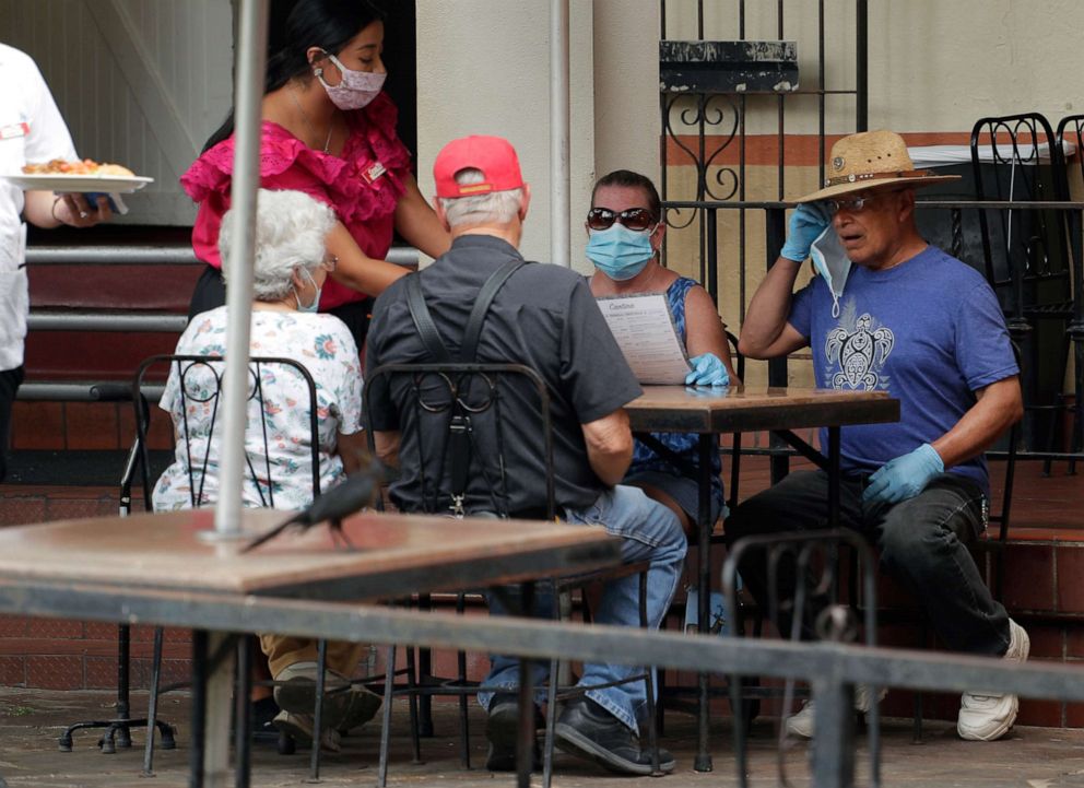 PHOTO: Diners are shown at a restaurant along the River Walk that has reopened in San Antonio, Texas, June 15, 2020.