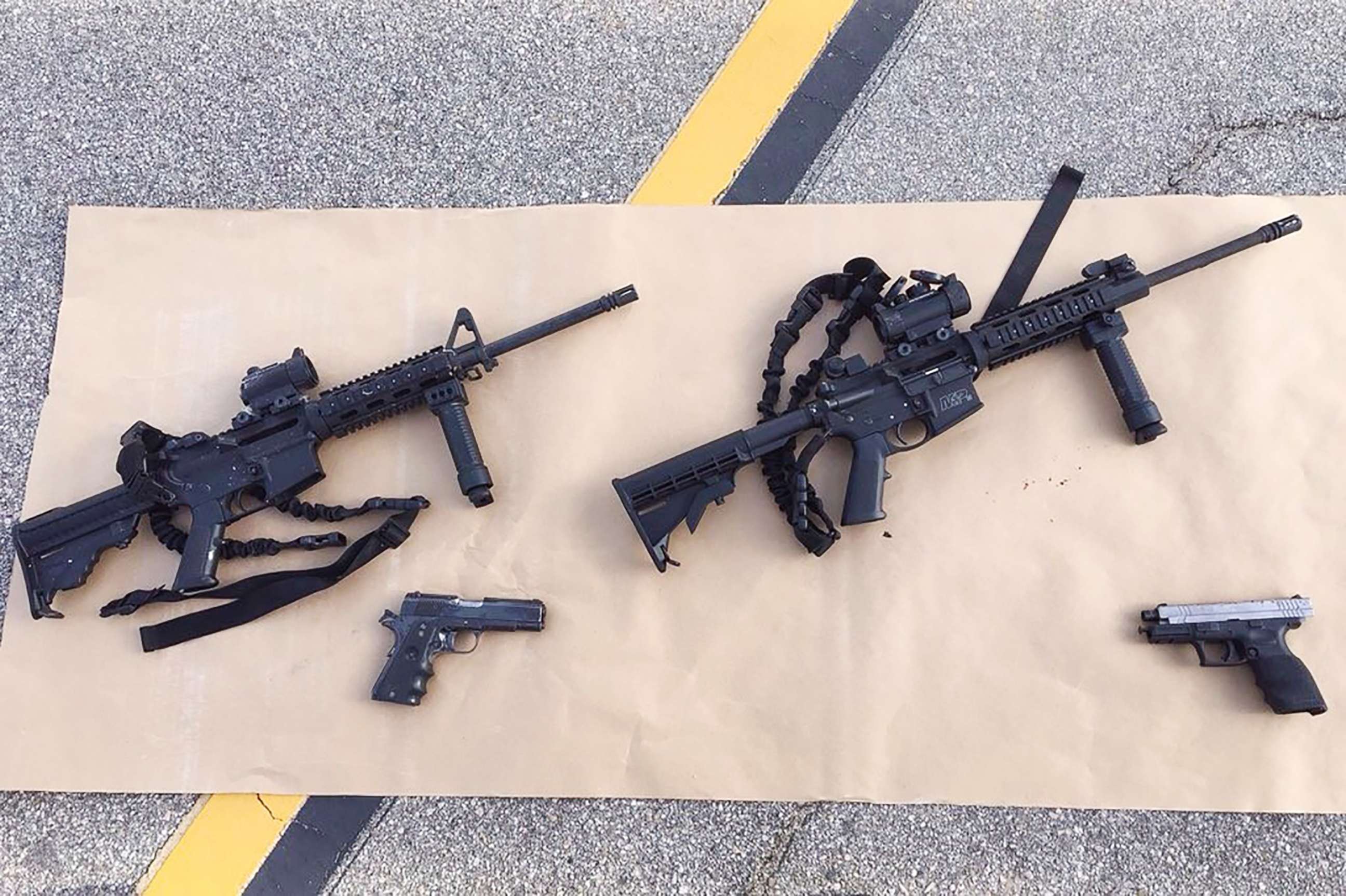 PHOTO: Four guns are seen near the site of a shootout between police and suspects in the San Bernardino shootings, Dec. 4, 2015, in San Bernardino, Calif, in this handout photo provided by the San Bernardino County Sherrif's Department.