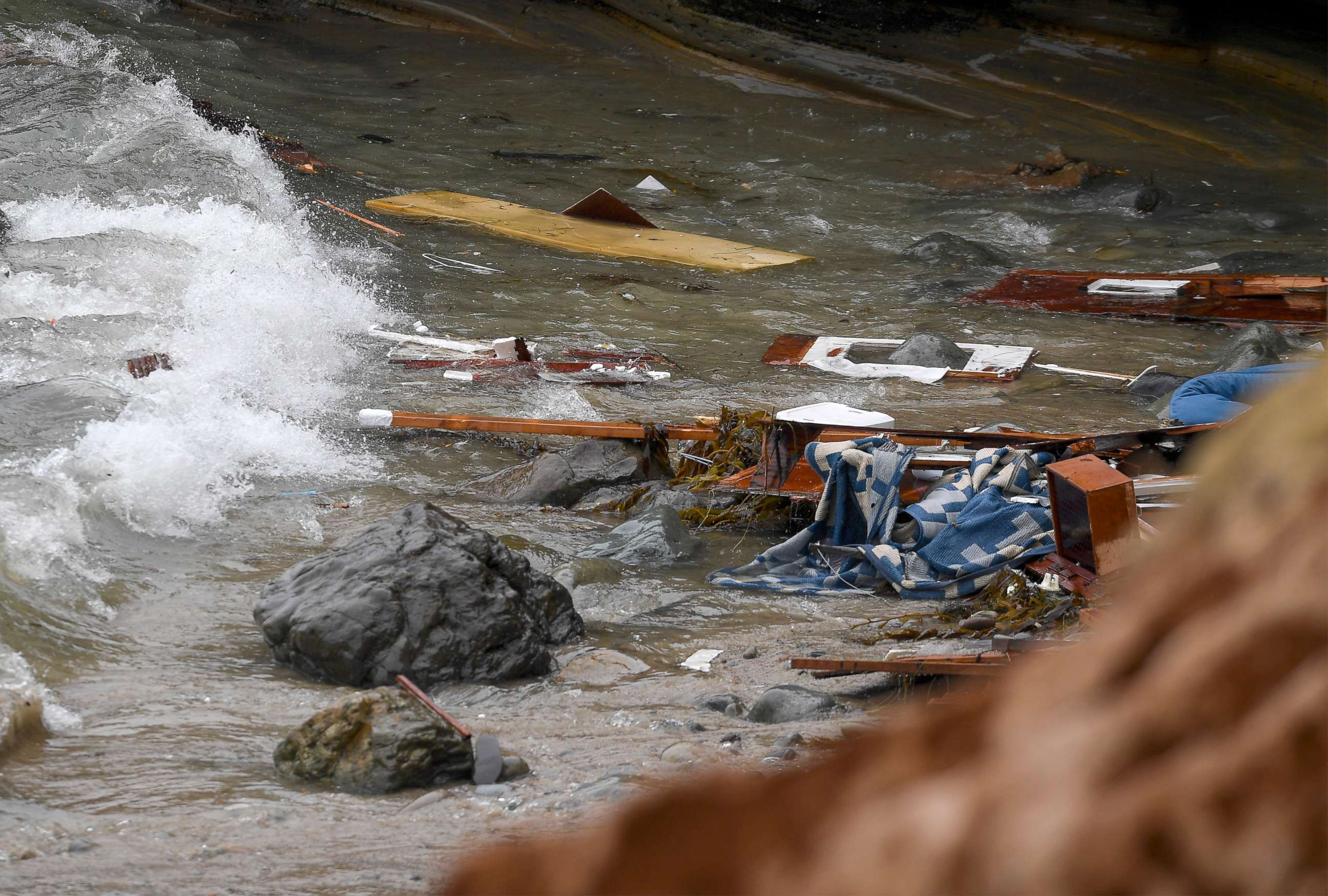 PHOTO: Wreckage and debris from a capsized boat washes ashore at Cabrillo National Monument near where a boat capsized just off the San Diego coast, May 2, 2021, in San Diego.