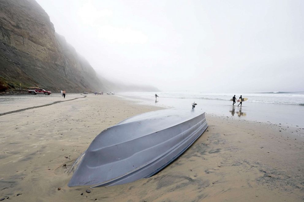 PHOTO: A boat sits overturned on Blacks Beach, March 12, 2023, in San Diego.