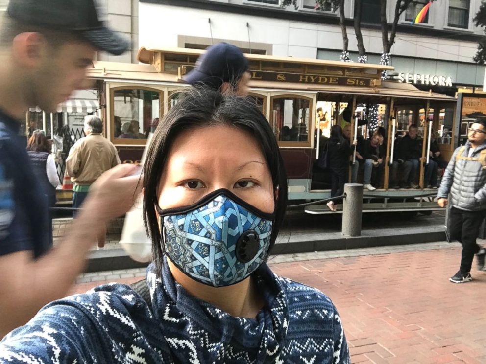 PHOTO: Jenny Shao, a graduate student in San Francisco, dons a mask Friday, Nov. 16, 2018, to protect from the city's poor air quality due to the Camp Fire. 