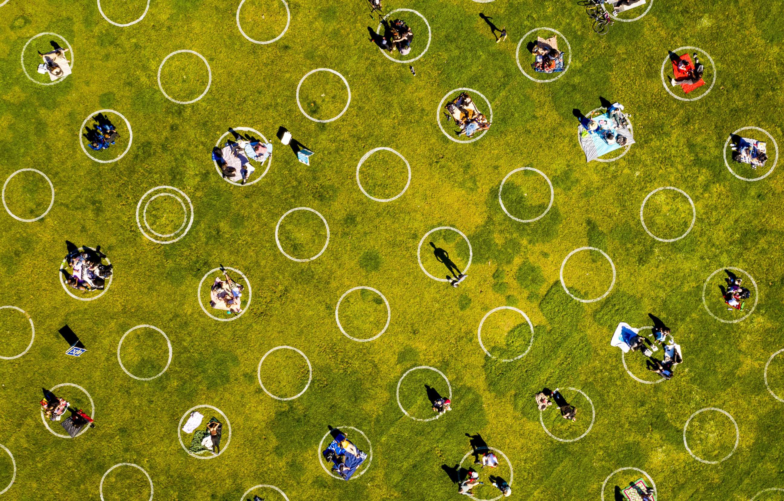 PHOTO: Circles designed to help prevent the spread of the coronavirus by encouraging social distancing line San Francisco's Dolores Park, May 21, 2020.