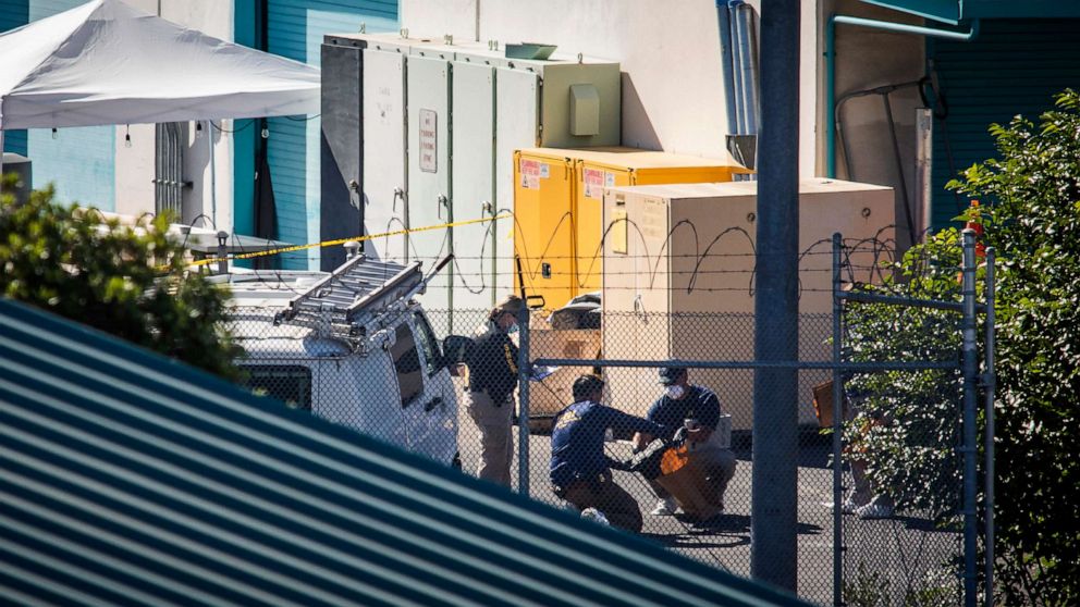 PHOTO: Investigators gather evidence at building B, after a mass shooting at the Valley Transportation Authority (VTA) light-rail yard, May 26, 2021 in San Jose, Calif.