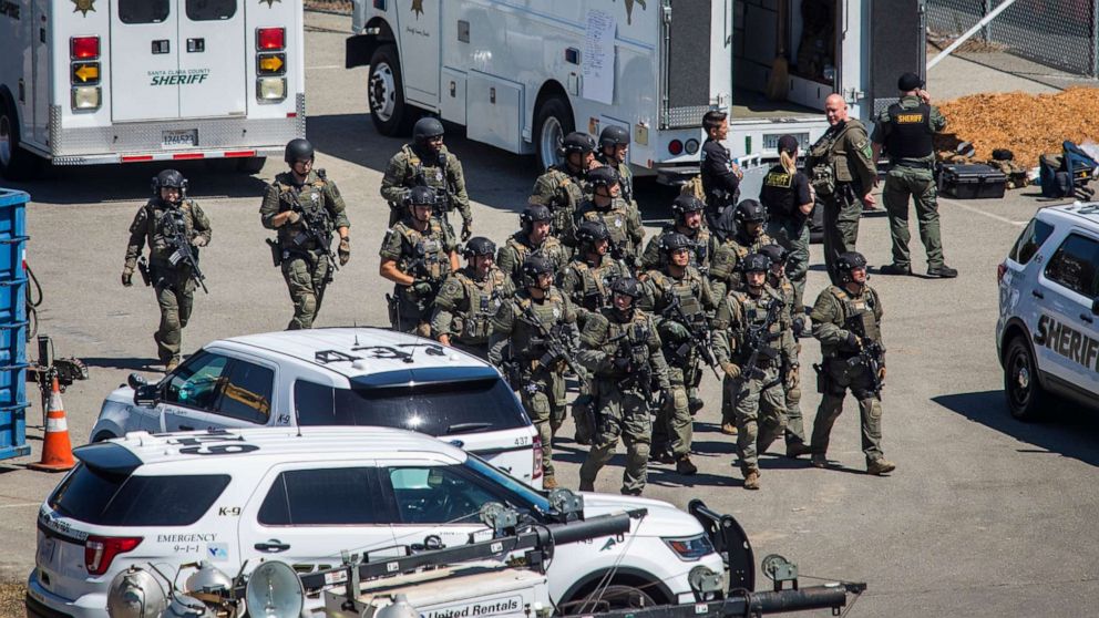 PHOTO: Tactical law enforcement officers move through the Valley Transportation Authority light-rail yard where a mass shooting occurred on May 26, 2021, in San Jose, Calif.