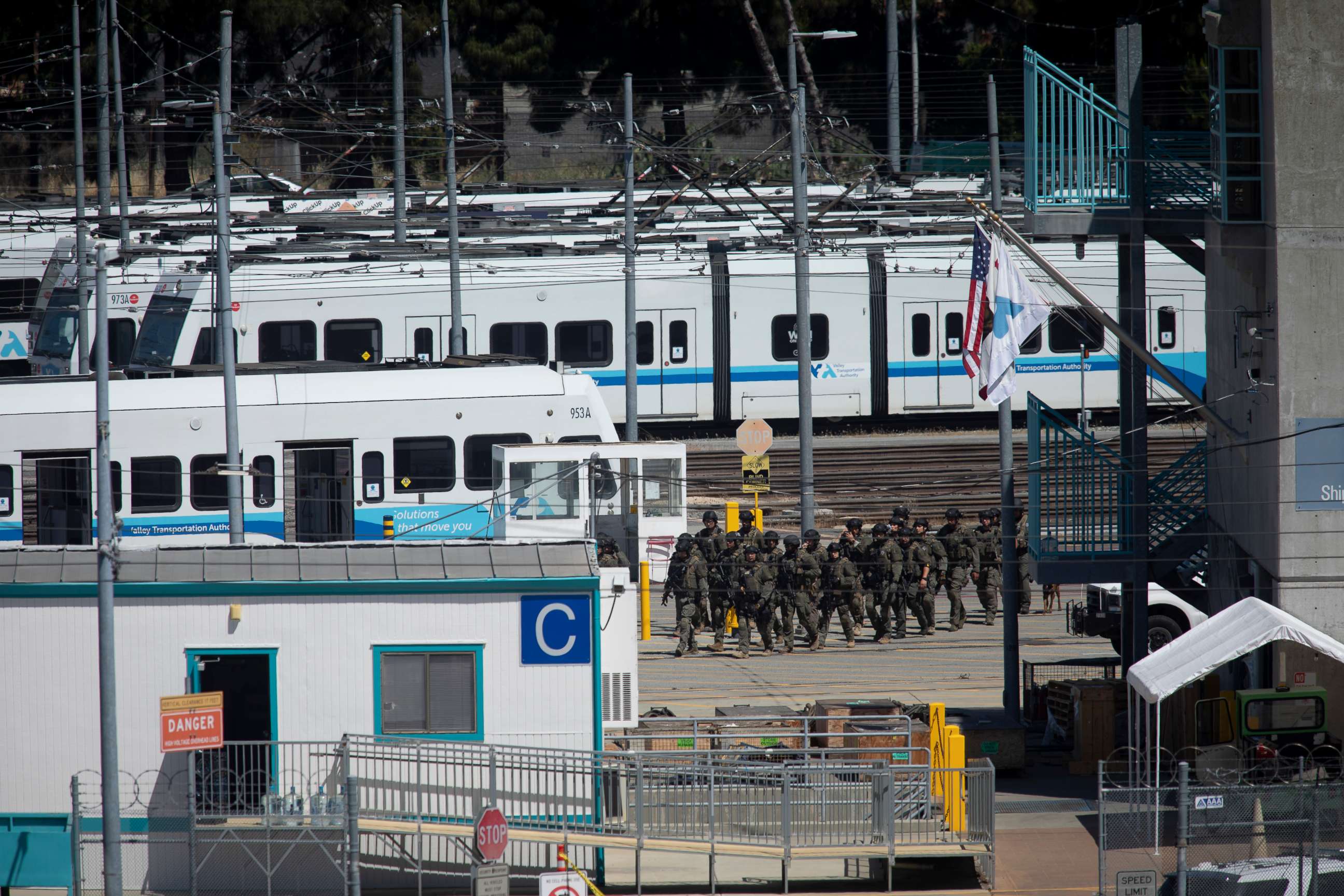 PHOTO: Tactical law enforcement officers move through the Valley Transportation Authority light-rail yard where a mass shooting occurred on May 26, 2021, in San Jose, Calif.