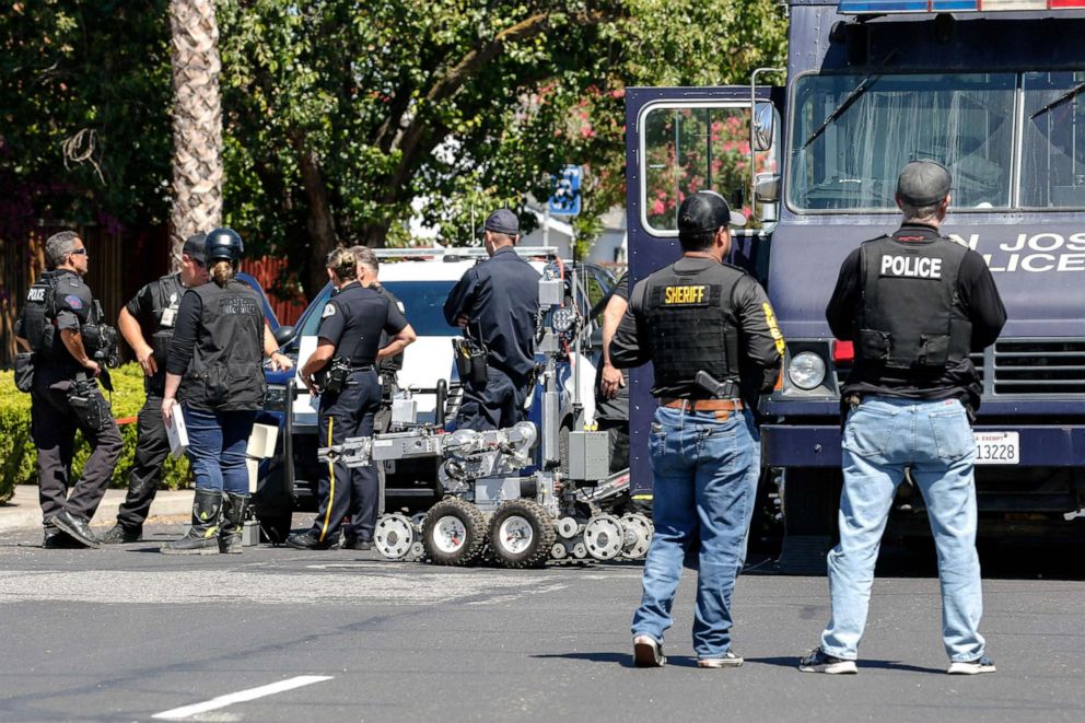 PHOTO: Emergency responders and the San Jose Bomb Squad respond to a fire at the house of the suspect of a shooting where nine people were reported dead including the shooter on May 26, 2021, at the San Jose Railyard in San Jose, Calif.