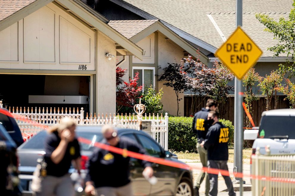 PHOTO: FBI agents approach a home that is being investigated in connection to a shooting at a Santa Clara Valley Transportation Authority facility on May 26, 2021, in San Jose, Calif.