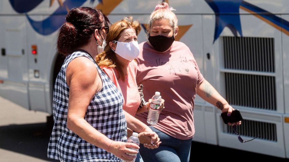 PHOTO: Women leave a gathering area for Santa Clara Valley Transportation Authority workers and family members following a shooting at one of the agency's rail yards on Wednesday, May 26, 2021, in San Jose, Calif.