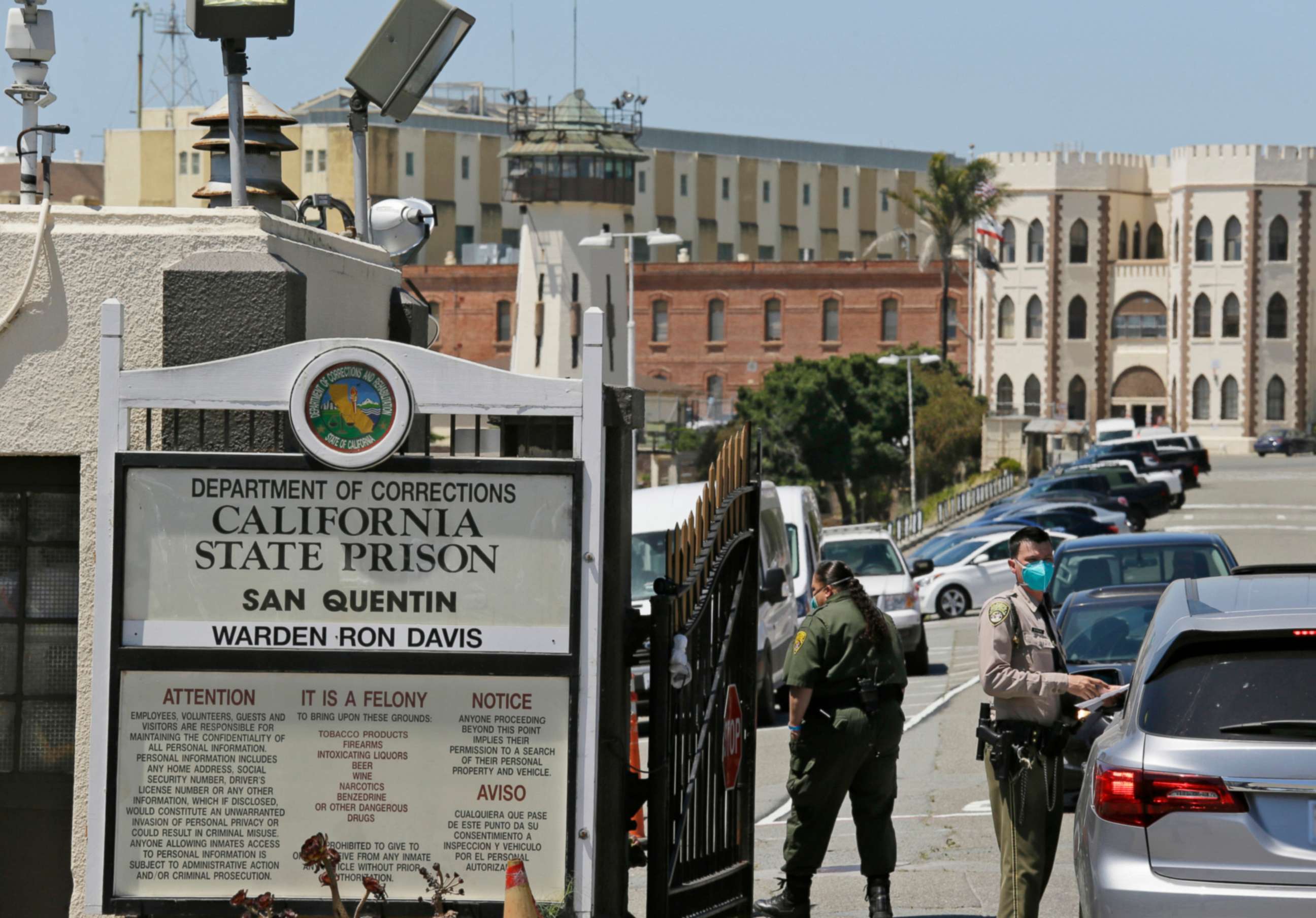 PHOTO: A correctional officer checks a car entering the main gate of San Quentin State Prison, July 9, 2020, in San Quentin, Calif.