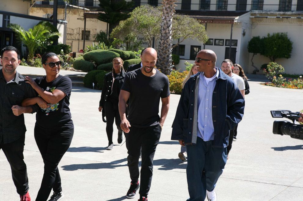PHOTO: Hip-hop artist Common, center, speaks with David Jassy, right, during a visit to the San Quentin Music Program at the San Quentin State Prison in California.