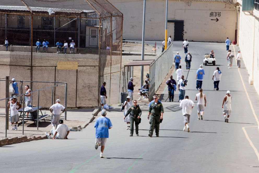 PHOTO: Inmates serving time at San Quentin prison walk around the yard, Sept. 27, 2016, in San Quentin, Calif.