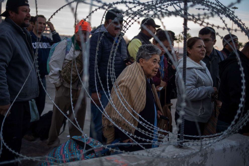 PHOTO: Concertina wire is pictured as people wait in line at the San Ysidro Port of Entry after the land border crossing was temporarily closed to foot and vehicle traffic from Tijuana, Mexico, Nov. 19, 2018.