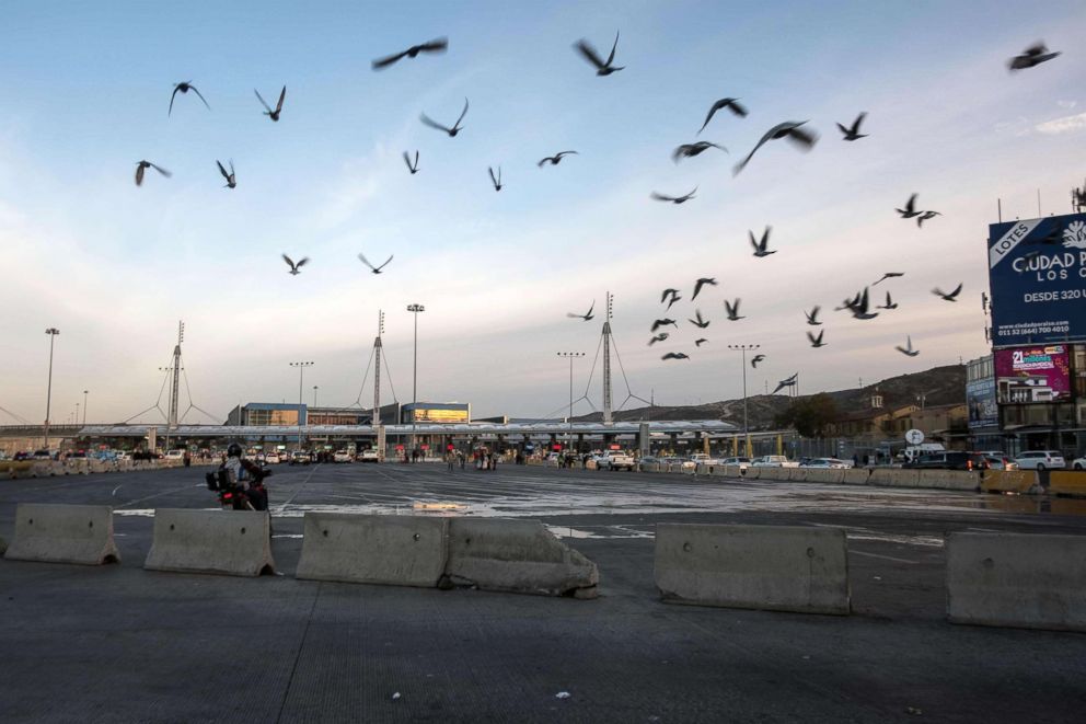 PHOTO: Birds fly over almost empty border crossing lines after US authorities have temporarily closed the San Ysidro entry point at the US-Mexico border, seen from Tijuana, Mexico, on November 19, 2018.