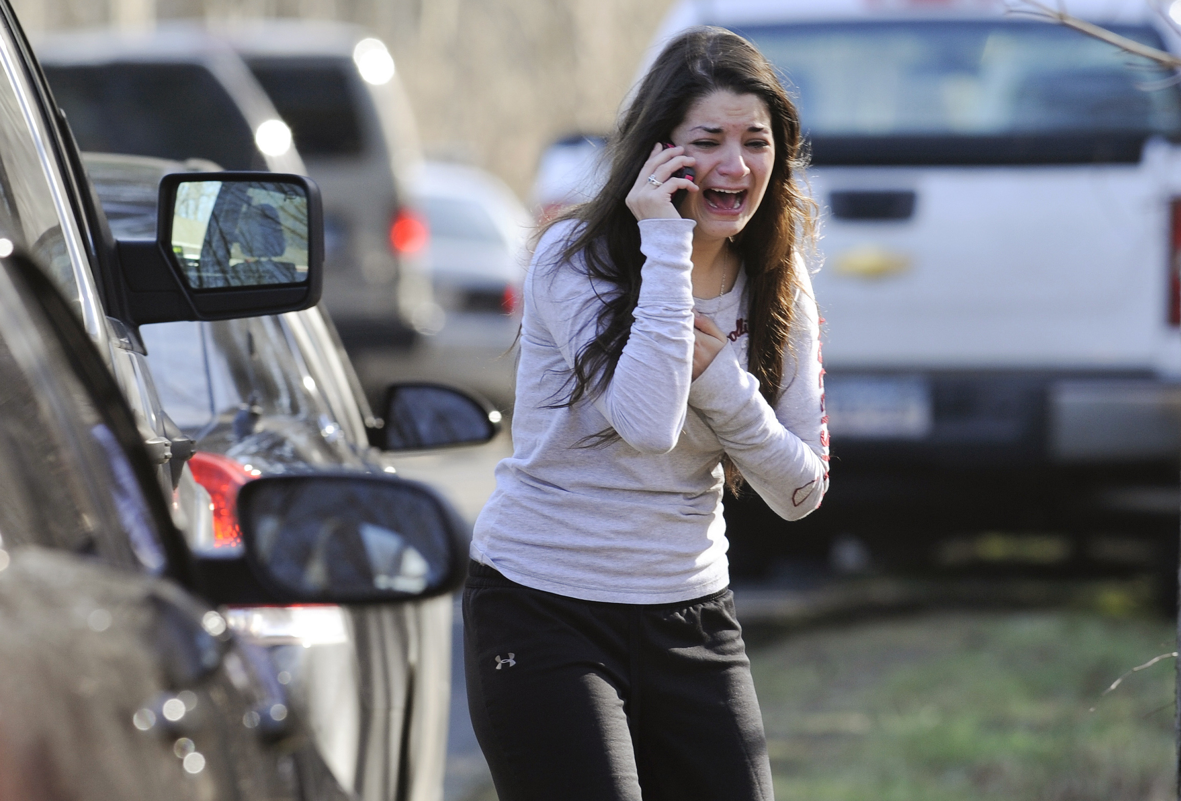 PHOTO: In this Dec. 14, 2012 file photo, Carlee Soto uses a phone to ask about her sister, Victoria Soto, a teacher at the Sandy Hook Elementary School in Newtown, Conn., after gunman Adam Lanza killed 26 people inside the school, including 20 children. 