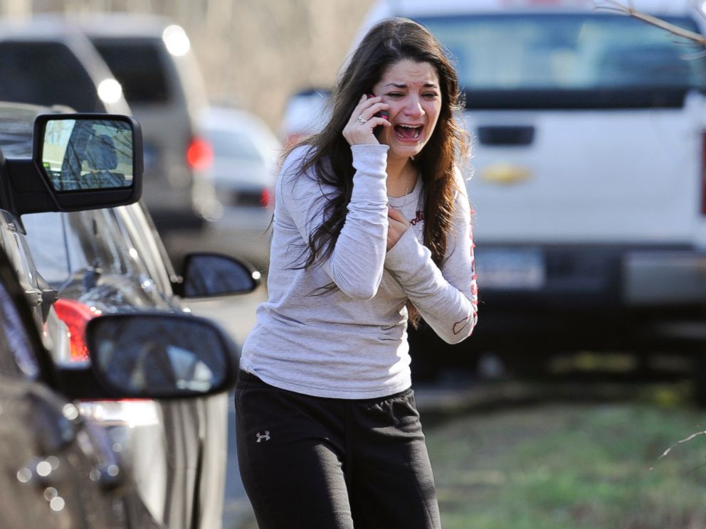 PHOTO: In this Dec. 14, 2012 file photo, Carlee Soto uses a phone to ask about her sister, Victoria Soto, a teacher at the Sandy Hook Elementary School in Newtown, Conn., after gunman Adam Lanza killed 26 people inside the school, including 20 children. 