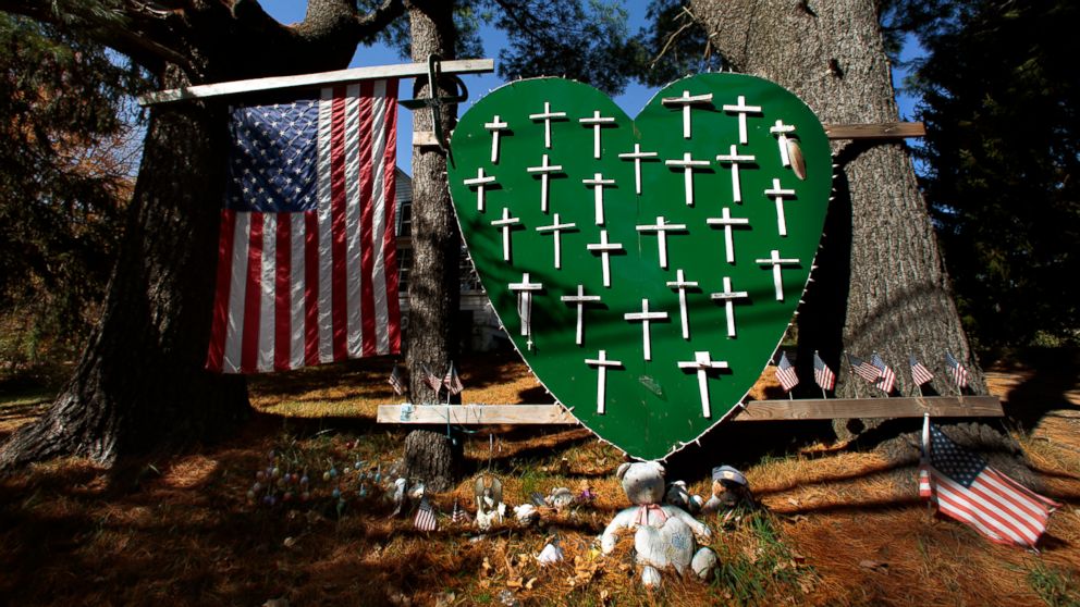 On Oct. 21, 2013, there are still signs around town of the grief felt after the shooting last Dec. 14, that left 20 elementary children and 6 school employees killed by Adam Lanza,  who also killed himself. This vigil was set up, a block from the school, soon after the shooting occurred, but remains in place. 