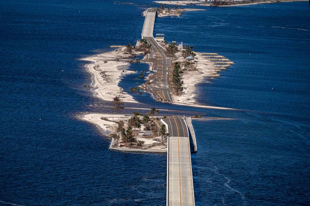 PHOTO: An aerial picture taken on Sept. 30, 2022, shows the collapsed Sanibel Causeway in the aftermath of Hurricane Ian in Sanibel, Fla.