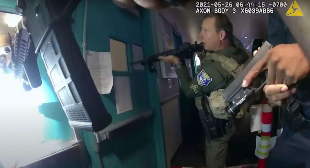 PHOTO: An image from body-camera as footage deputies approach a set of doors with their weapons drawn inside a building at the Santa Clara Valley Transportation Authority bus and rail yard, May 26, 2021, in San Jose, Calif.