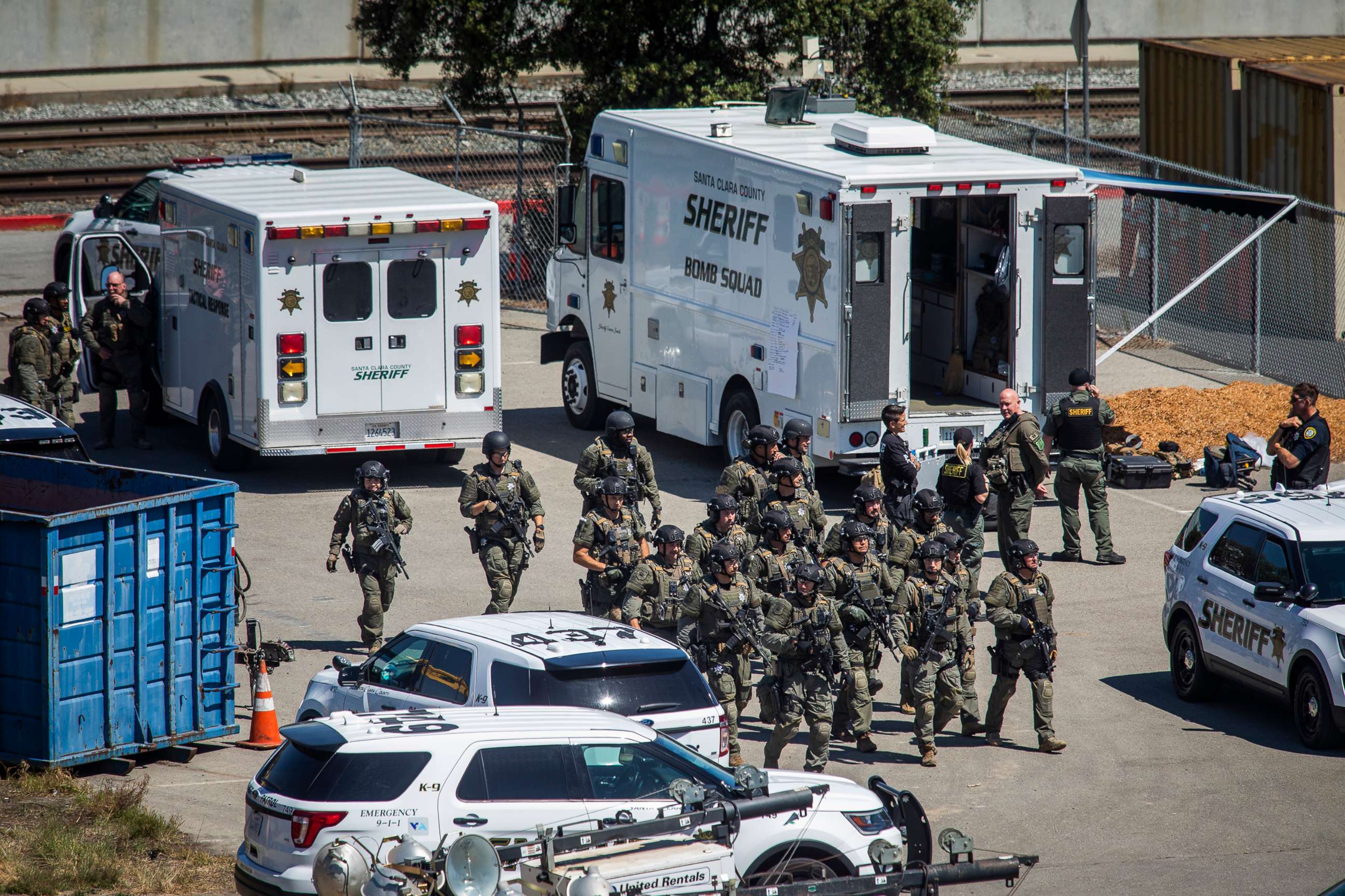 PHOTO: Tactical law enforcement officers move through the Valley Transportation Authority (VTA) light-rail yard where a mass shooting occurred on May 26, 2021 in San Jose, Calif. 