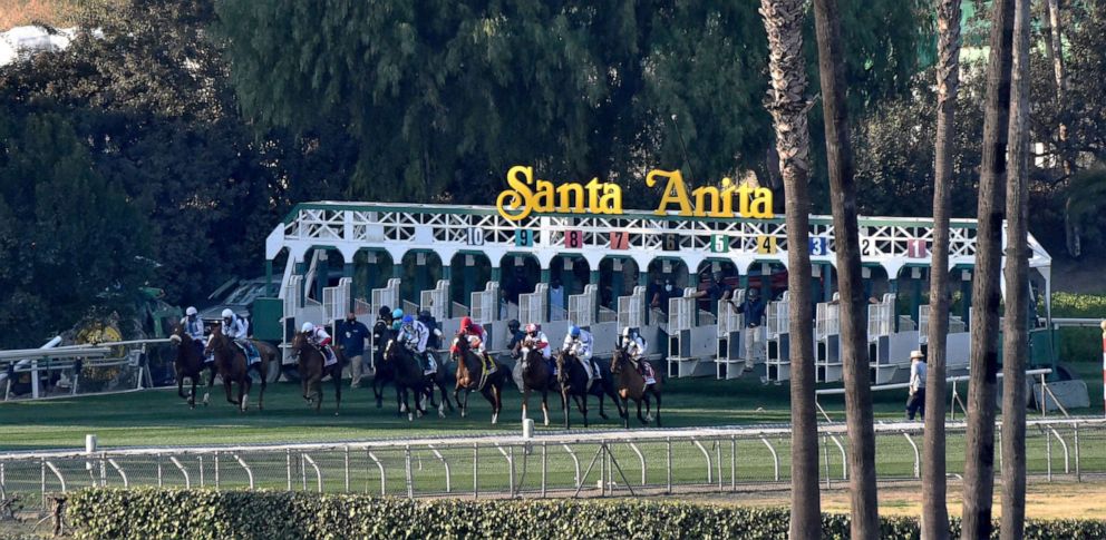 PHOTO: In this Dec. 26, 2020, file photo, horses run out of the gate at the American Oaks turf race during opening day of horse racing at Santa Anita Park in Arcadia, Calif.