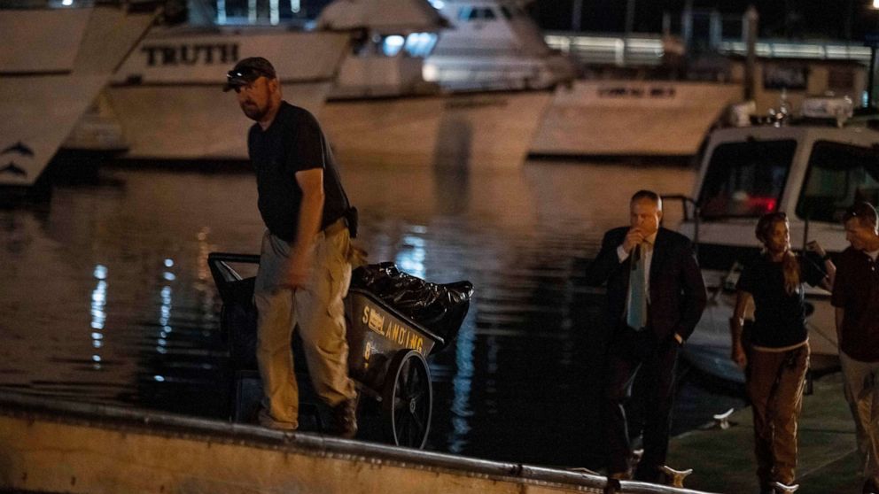 PHOTO: Authorities cart away evidence taken from the scuba boat Conception in Santa Barbara Harbor at the end of their second day searching for the remaining divers who were missing on Sept. 3, 2019, in Santa Barbara, Calif.