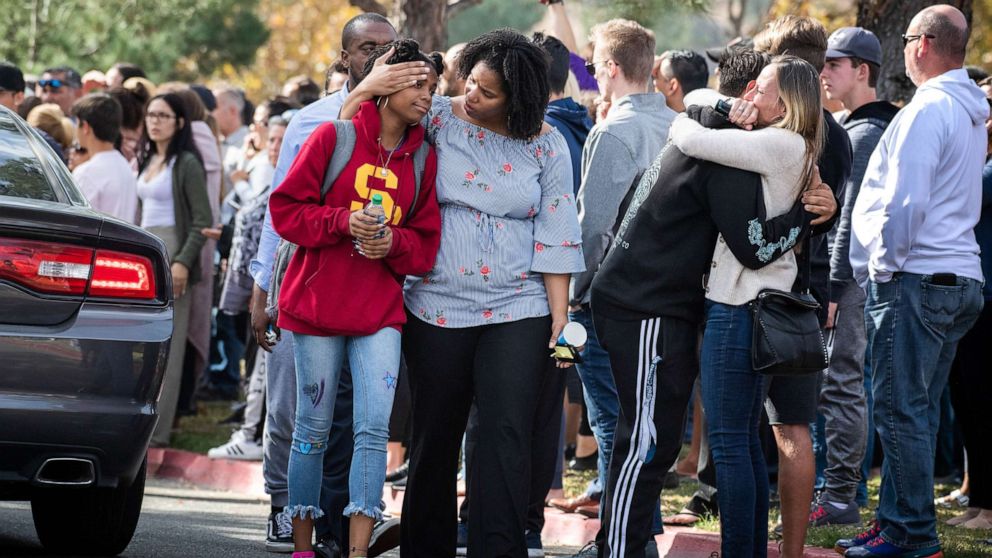PHOTO: Saugus High School students reunite with their families after a mass shooting at their Santa Clarita High School that left two dead, Nov. 14, 2019.