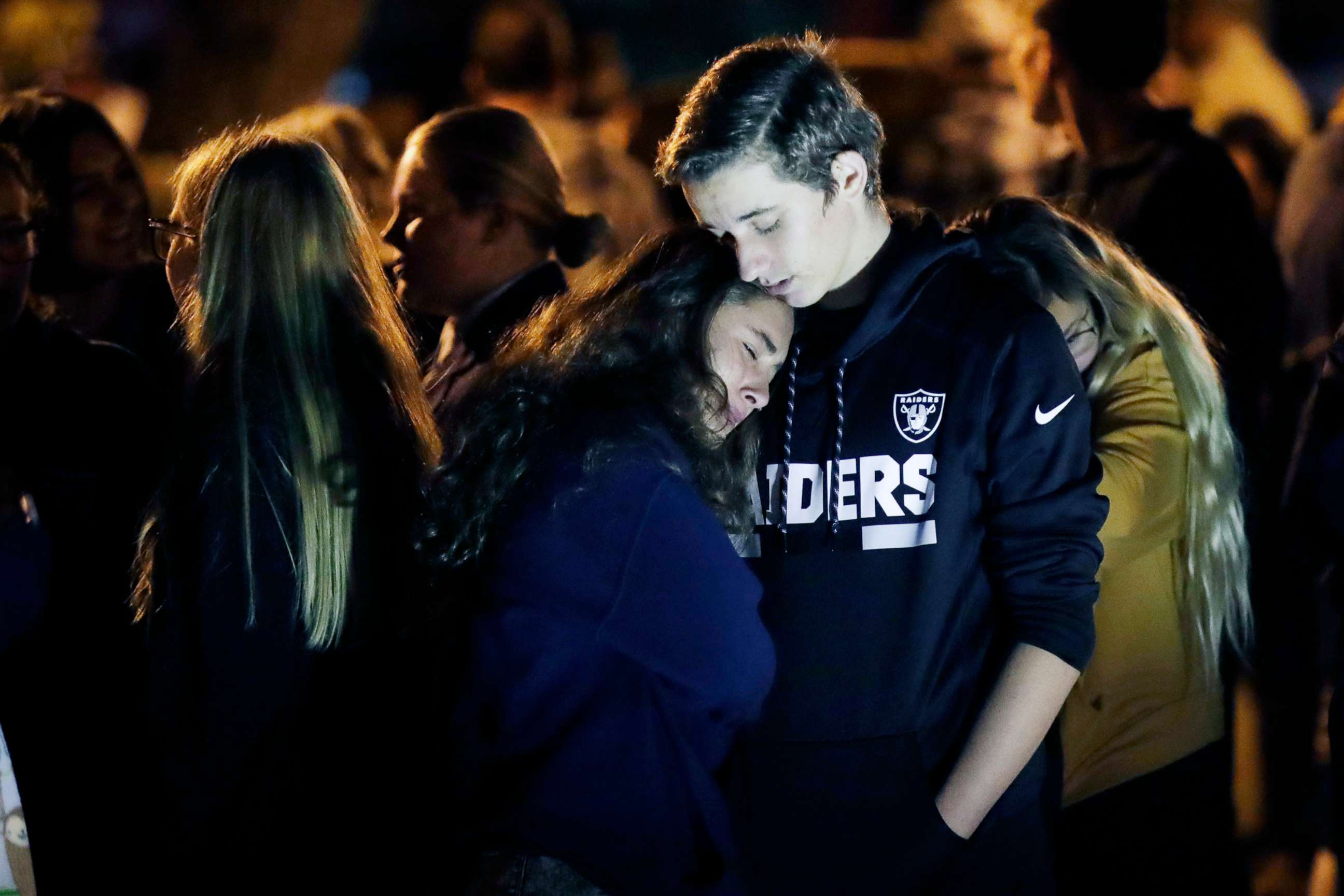 PHOTO: Hannah Schooping-Gutierrez, center, is comforted by her boyfriend Declan Sheridan, at right, a student at nearby Valencia High School during a vigil at Central Park in the aftermath of a shooting at Saugus  Nov. 14, 2019, in Santa Clarita, Calif.
