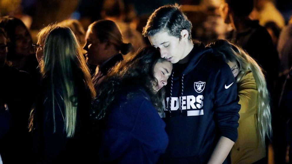 PHOTO: Hannah Schooping-Gutierrez, center, is comforted by her boyfriend Declan Sheridan, at right, a student at nearby Valencia High School during a vigil at Central Park in the aftermath of a shooting at Saugus  Nov. 14, 2019, in Santa Clarita, Calif.
