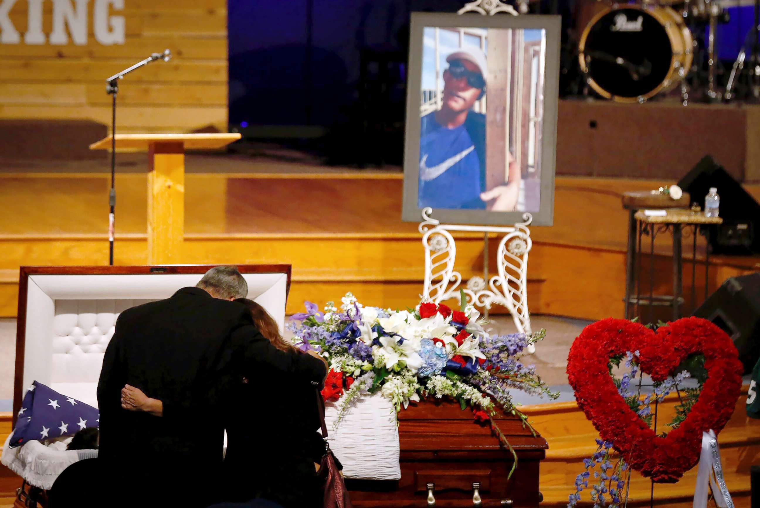 PHOTO: Mourners embrace in front of Christian Riley Garcia's casket during a funeral service at Crosby Church on May 25, 2018, in Crosby, Texas.