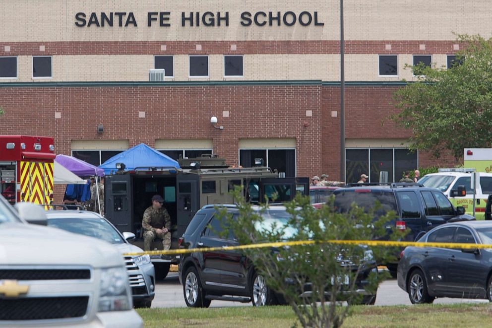 PHOTO: Emergency crews gather in the parking lot of Santa Fe High School after a shooter opened fire, May 18, 2018, in Santa Fe, Texas.