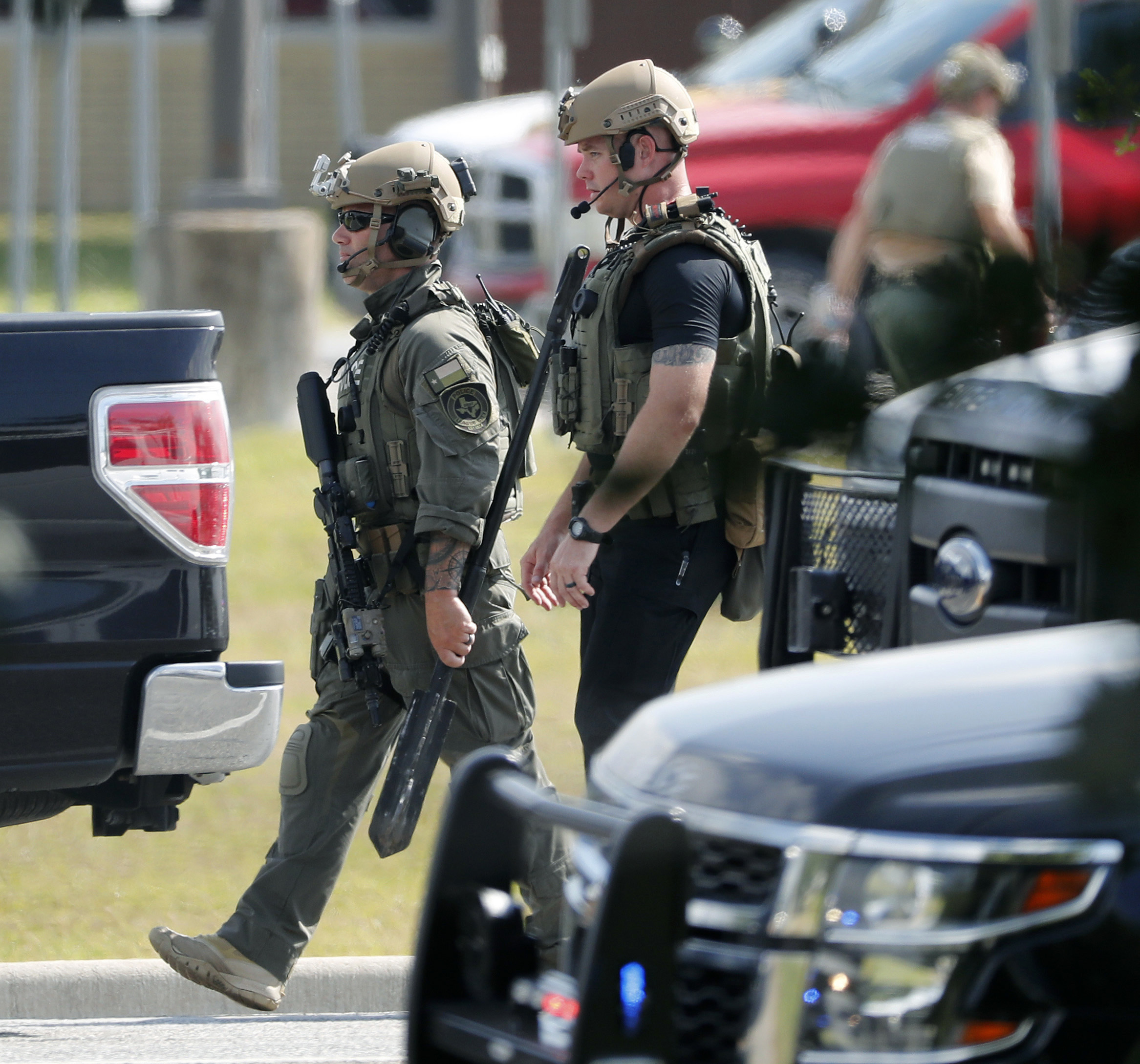 PHOTO: Police officers in tactical gear move through the scene at Santa Fe High School after a shooting on May 18, 2018, in Santa Fe, Texas.