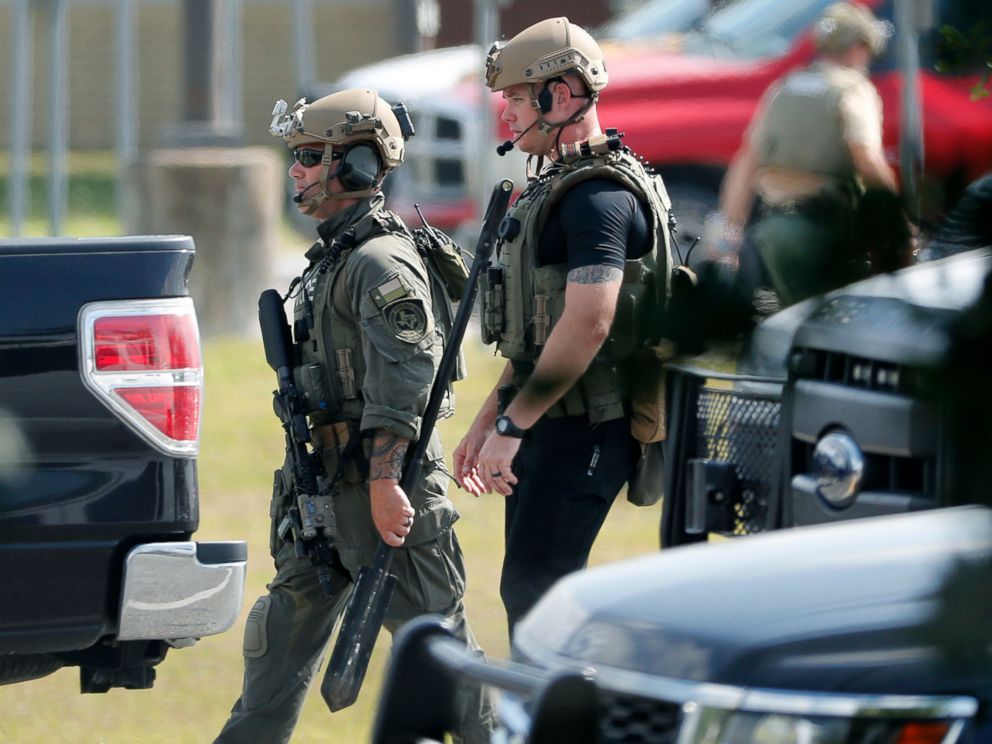 PHOTO: Police officers in tactical gear move through the scene at Santa Fe High School after a shooting on May 18, 2018, in Santa Fe, Texas.