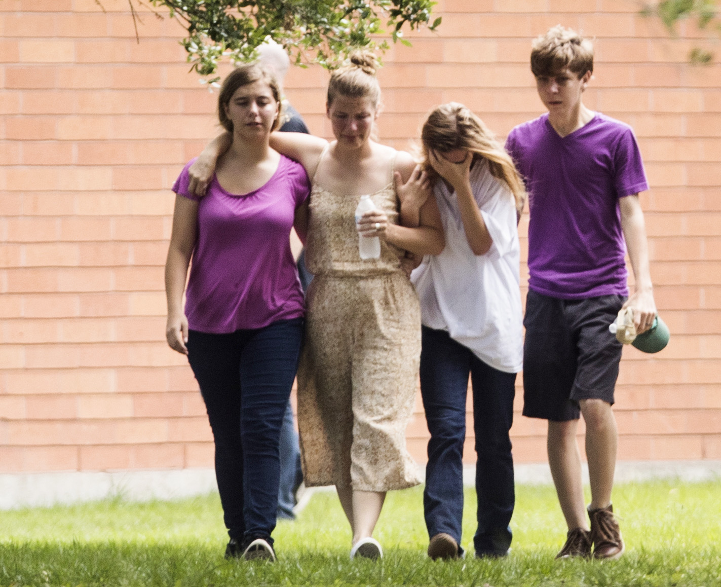 PHOTO: Students gather by the Barnett Intermediate School where parents are gathering to pick up their children following a shooting at Santa Fe High School, May 18, 2018, in Santa Fe, Texas.