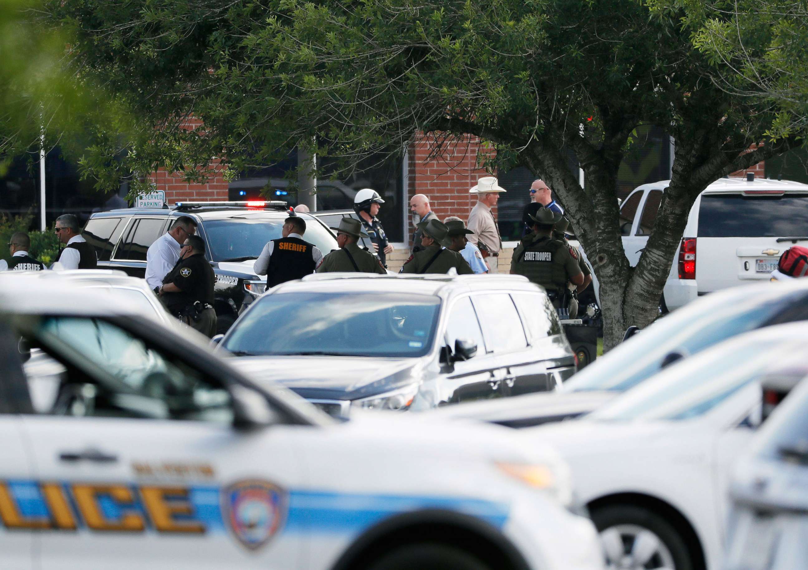 PHOTO: Emergency responders from multiple agencies work at the scene in front of Santa Fe High School in response to a shooting, May 18, 2018, in Santa Fe, Texas.