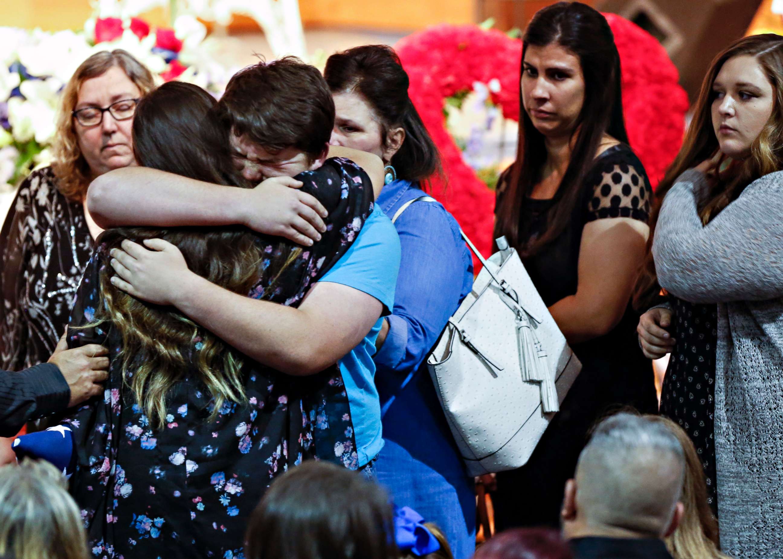 Mourners embrace the family of Christian Riley Garcia during his funeral at Crosby Church on May 25, 2018, in Houston. The 15-year-old student was one of 10 people killed on May 18, 2018, during a mass shooting at Santa Fe High School. 