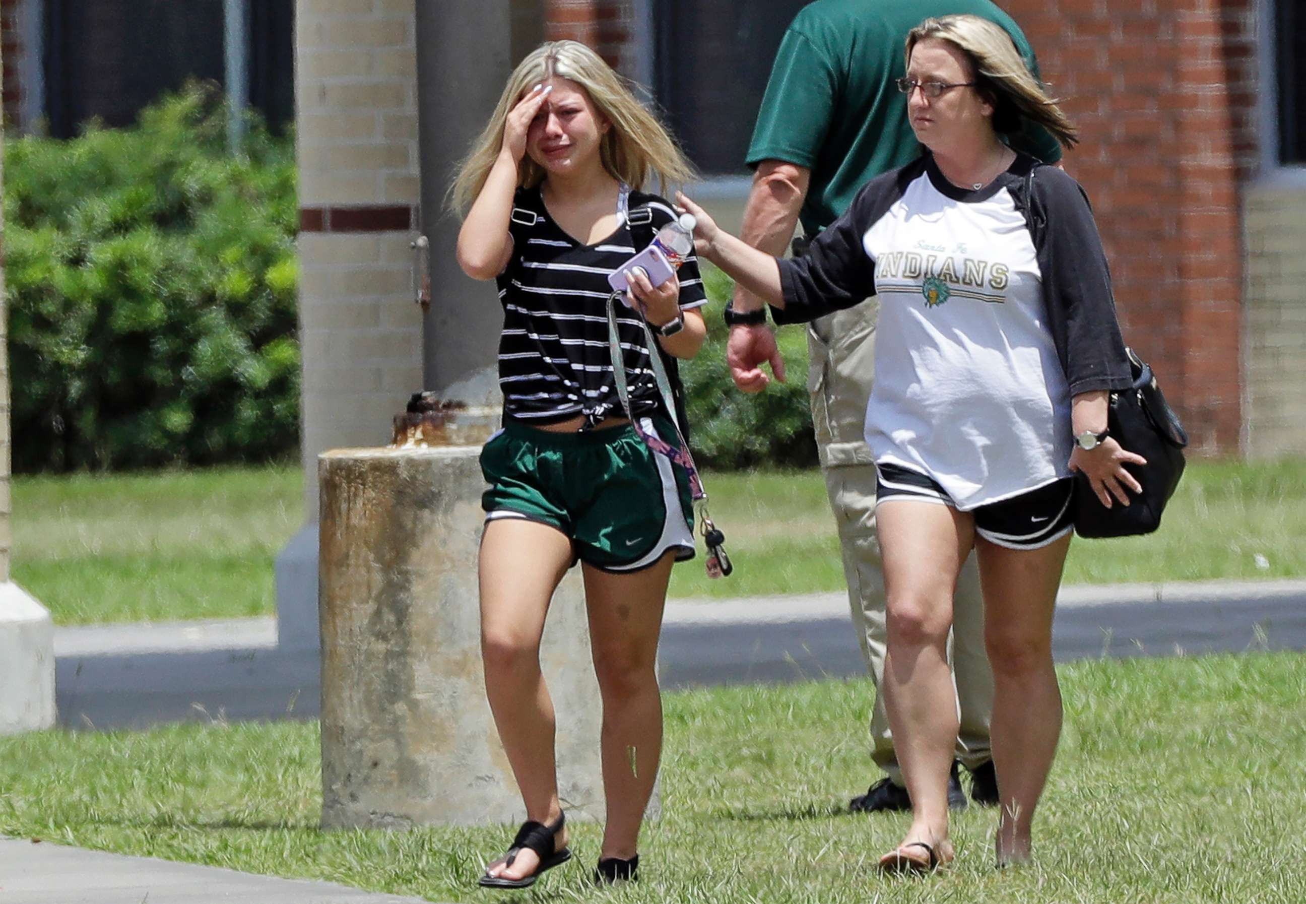 PHOTO: A student, left, reacts after retrieving her belongings inside Santa Fe High School in Santa Fe, Texas, May 19, 2018. Students and teachers were allowed to return to parts of the school to gather their belongings on Saturday.