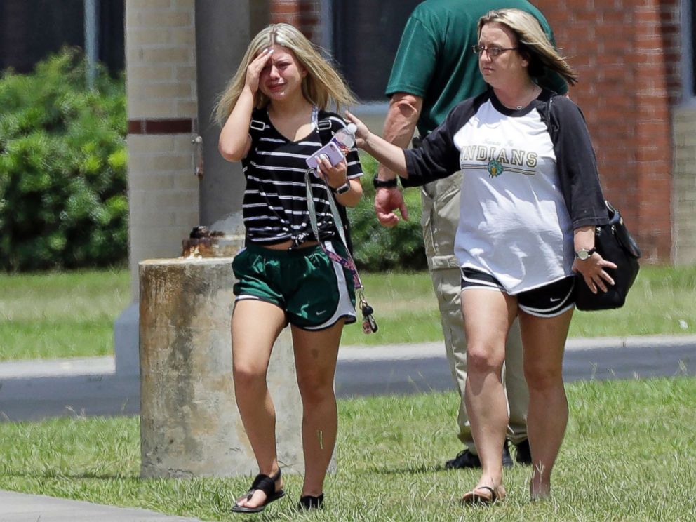 PHOTO: A student, left, reacts after retrieving her belongings inside Santa Fe High School in Santa Fe, Texas, May 19, 2018. Students and teachers were allowed to return to parts of the school to gather their belongings on Saturday.