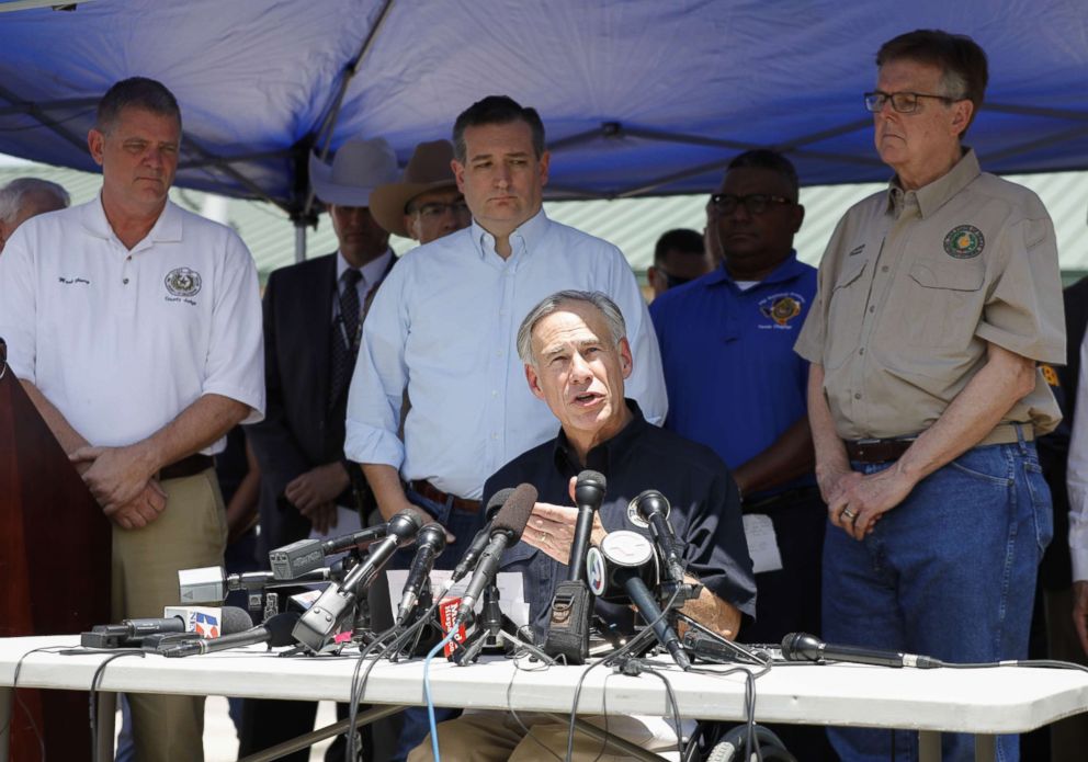 PHOTO: Texas Gov. Greg Abbott speaks to the media during a press conference about the shooting incident at Santa Fe High School on May 18, 2018 in Santa Fe, Texas. Standing from left, Judge Mark Henry, Sen.Ted Cruz, and Texas Lt. Gov. Dan Patrick.