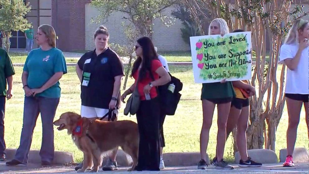 PHOTO: Santa Fe High School students were greeted by community members holding signs of support as they returned to class, May 29, 2018.
