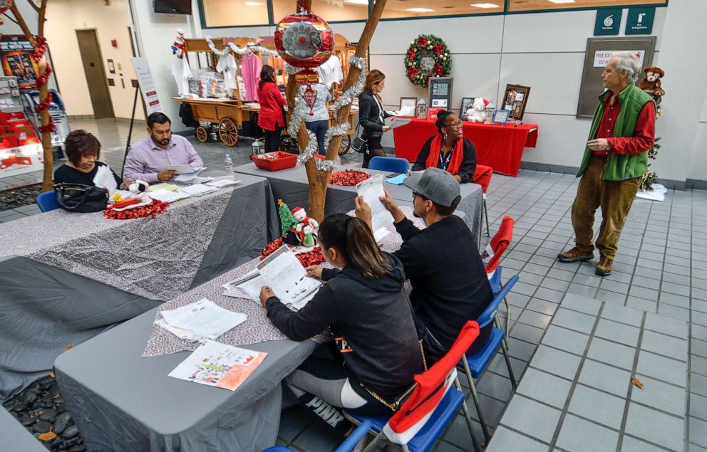 PHOTO: In this Dec. 5, 2017, file photo, volunteers comb through letters to Santa written by needy kids at the post office in Los Angeles.