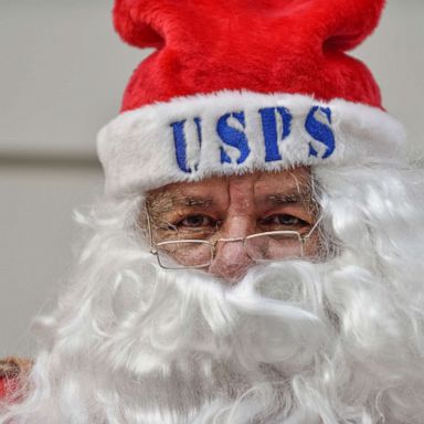 PHOTO: In this Dec. 5, 2017, file photo, Santa Claus greets visitors during Operation Santa at the post office in Los Angeles.