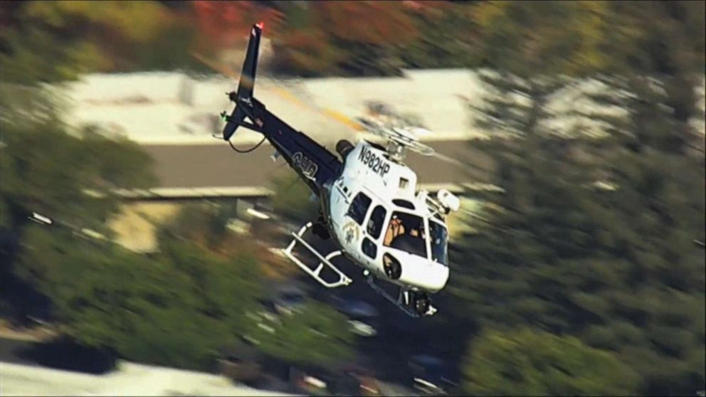 PHOTO: A California Highway Patrol helicopter circles close to the scene of a reported shooting near Ridgway High School in Santa Rosa, Calif., Oct. 22, 2019.