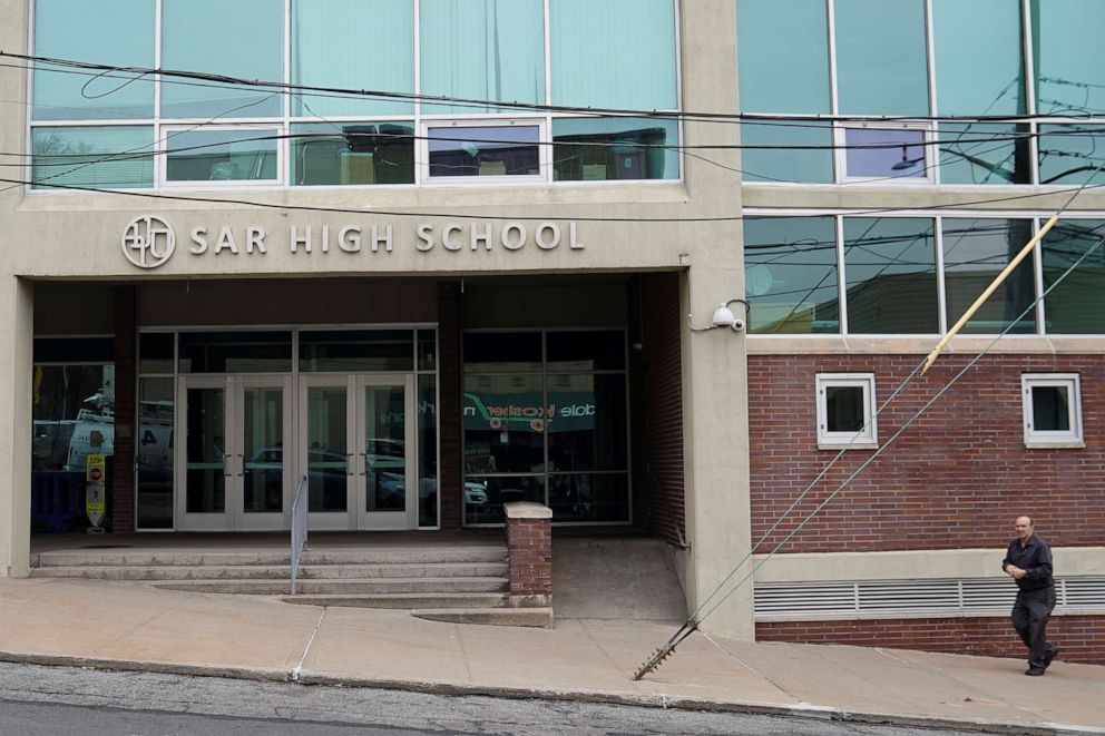 PHOTO: A man walks past SAR High School, which has been shut down due to an outbreak of the novel coronavirus, in the Bronx borough of New York City, New York, March 3, 2020.