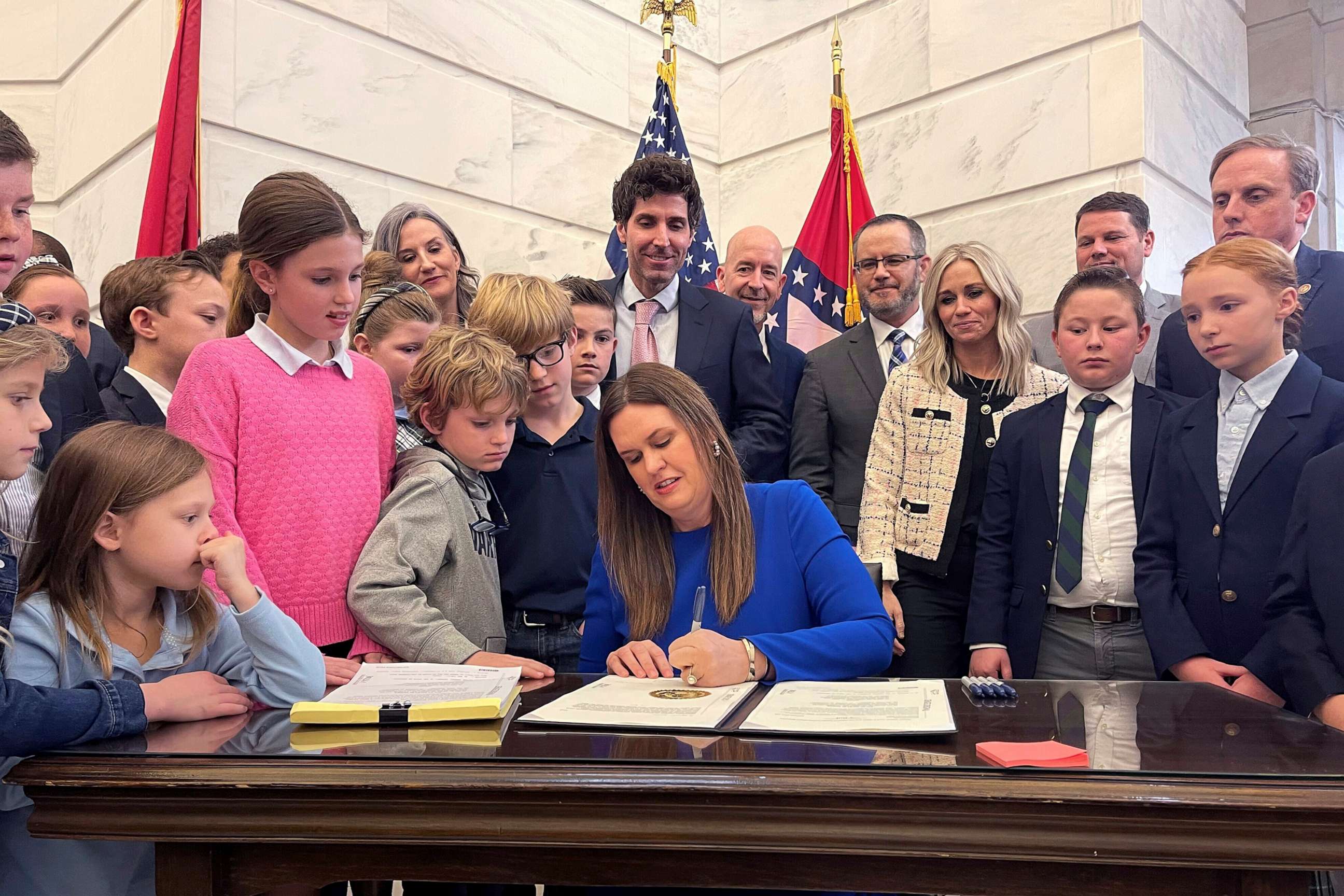 PHOTO: Arkansas Gov. Sarah Huckabee Sanders signs into law an education overhaul bill on March 8, 2023, at the state Capitol in Little Rock, Ark.