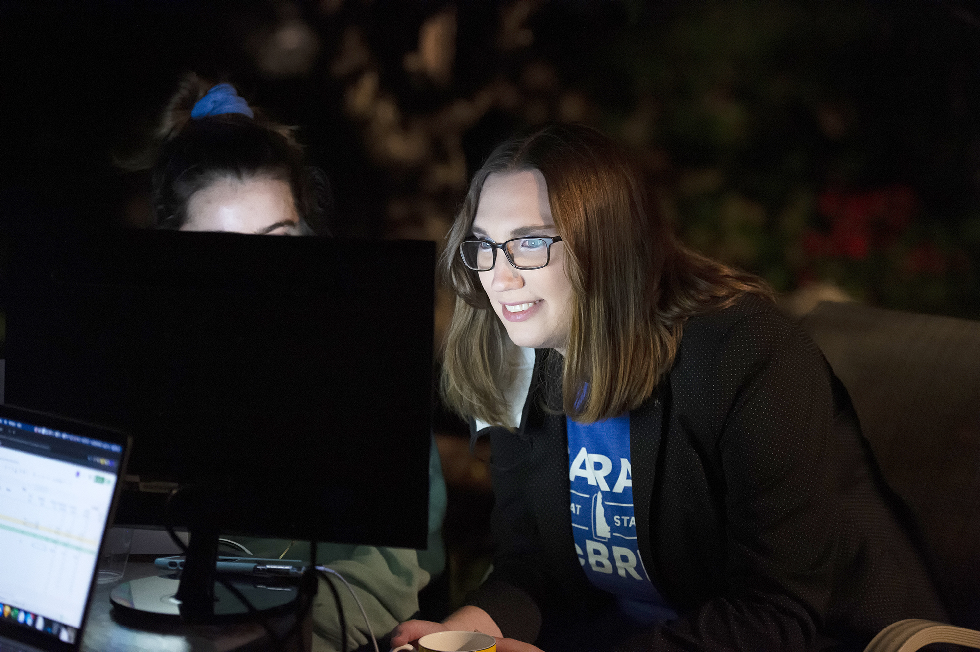PHOTO: Transgender activist and Senate hopeful Sarah McBride watches a computer screen at her watch party in Wilmington, Del., Sept. 15, 2020.