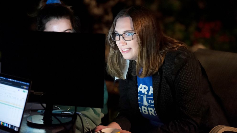 PHOTO: Transgender activist and Senate hopeful Sarah McBride watches a computer screen at her watch party in Wilmington, Del., Sept. 15, 2020.