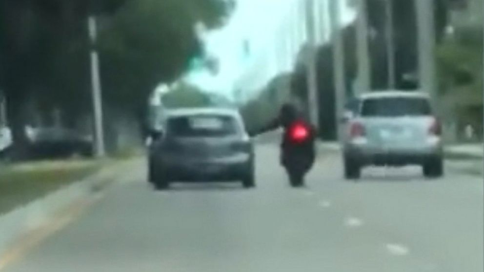 Motorist caught on video reportedly knocking motorcyclist off the road ...
